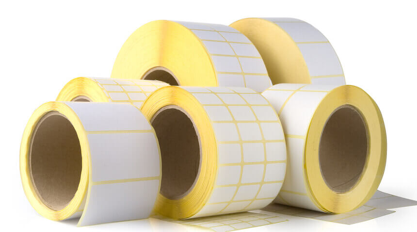 Image of sticky back labels in a roll.