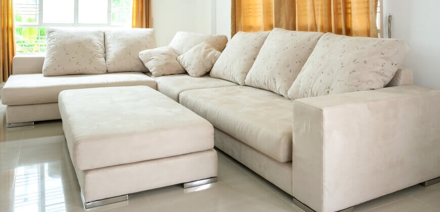 Image of wide sofa at a home. 