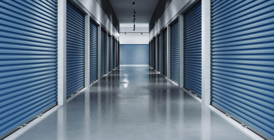 Image of the hallway of a self storage unit facility.