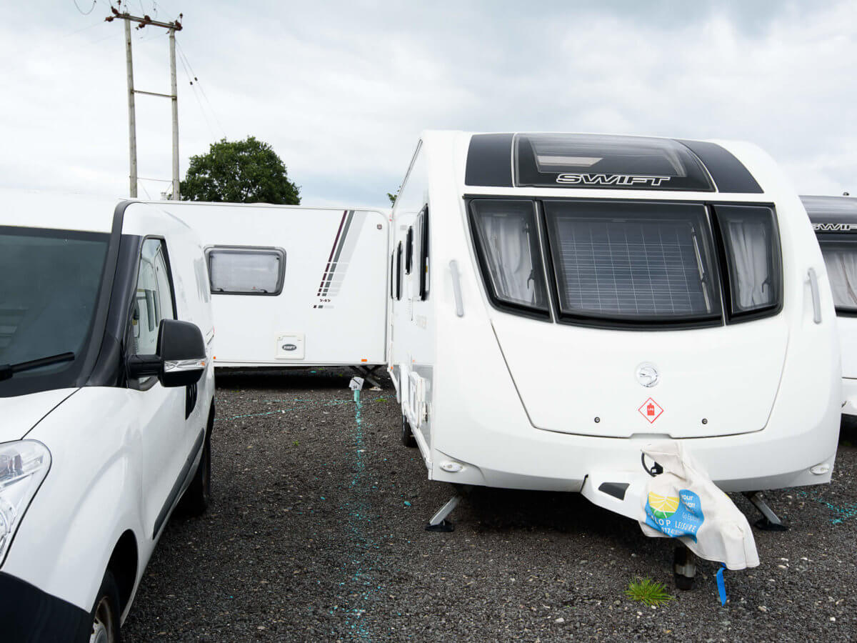 Close up on a van and three caravans