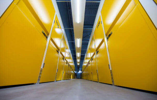 Corridor with lots of doors to storage containers