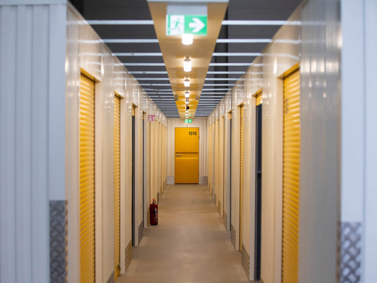 Corridor with lots of doors to storage containers