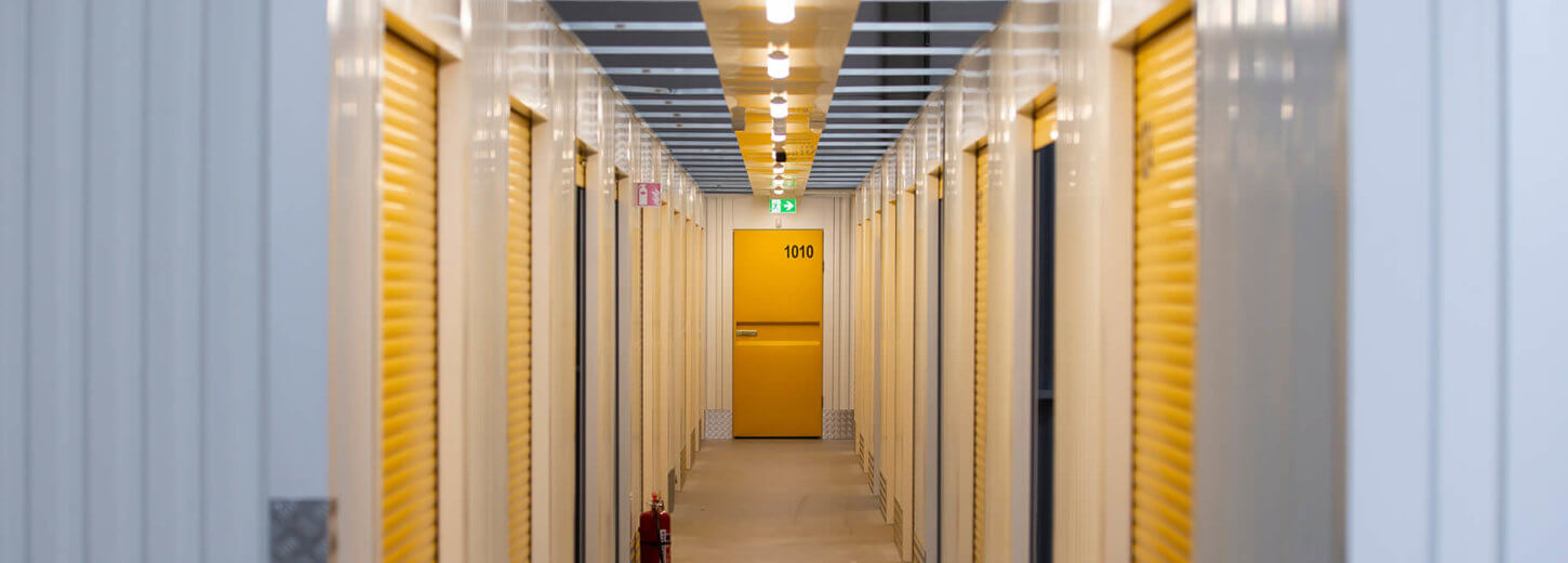 Corridor with lots of doors to storage containers