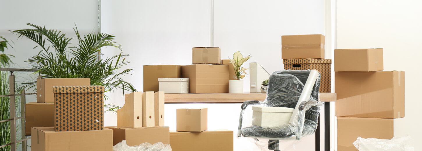 Image of home furniture with moving boxes.