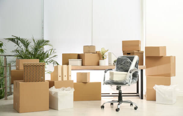 Image of home furniture with moving boxes.