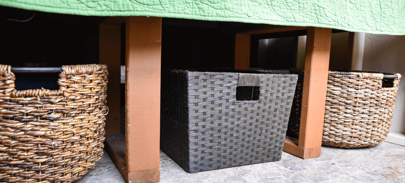 Three baskets in under-bed storage.