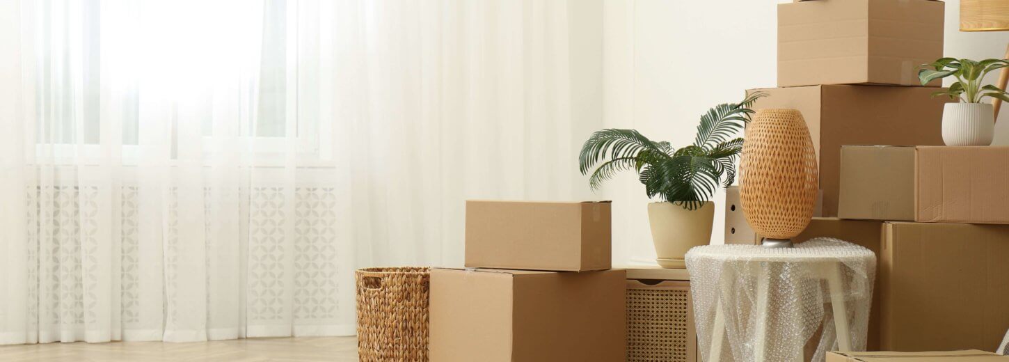 Rental home with boxes of belongings piled up for storage.