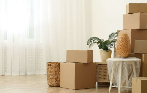 Rental home with boxes of belongings piled up for storage.