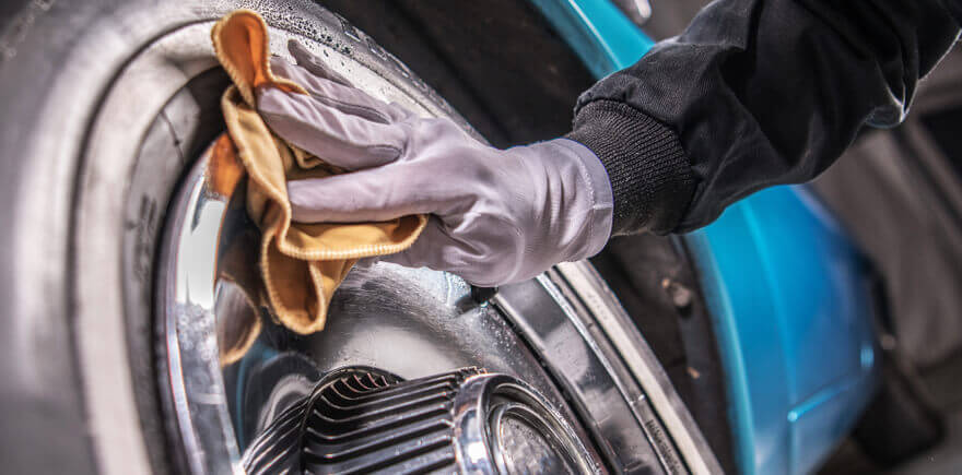 Image of someone maintaining a classic car.
