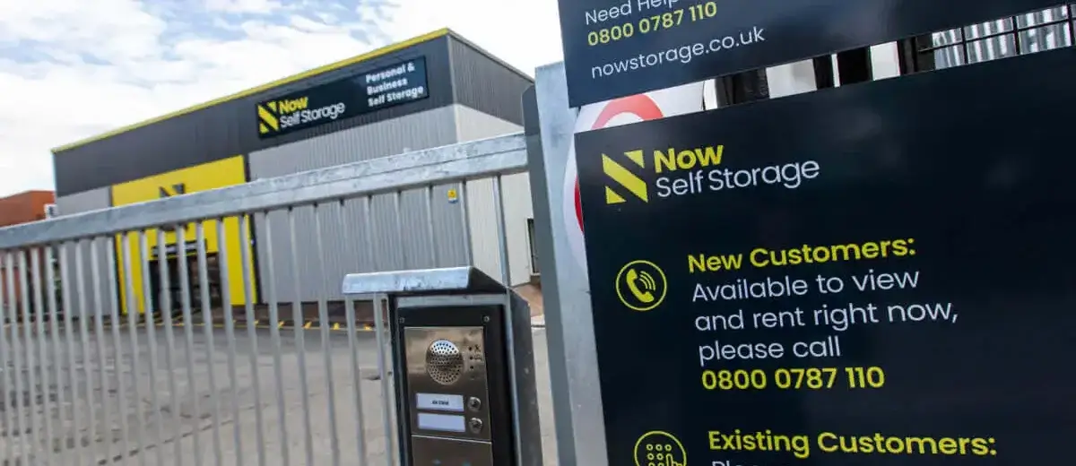 An exterior of a Now Storage facility with a metal gate