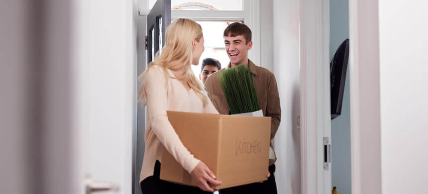 Image of young people moving into a new house.