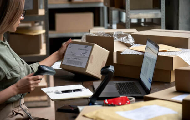 Image of a woman arranging product boxes.