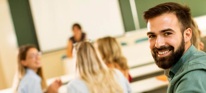 Image of students in a lecture hall room.