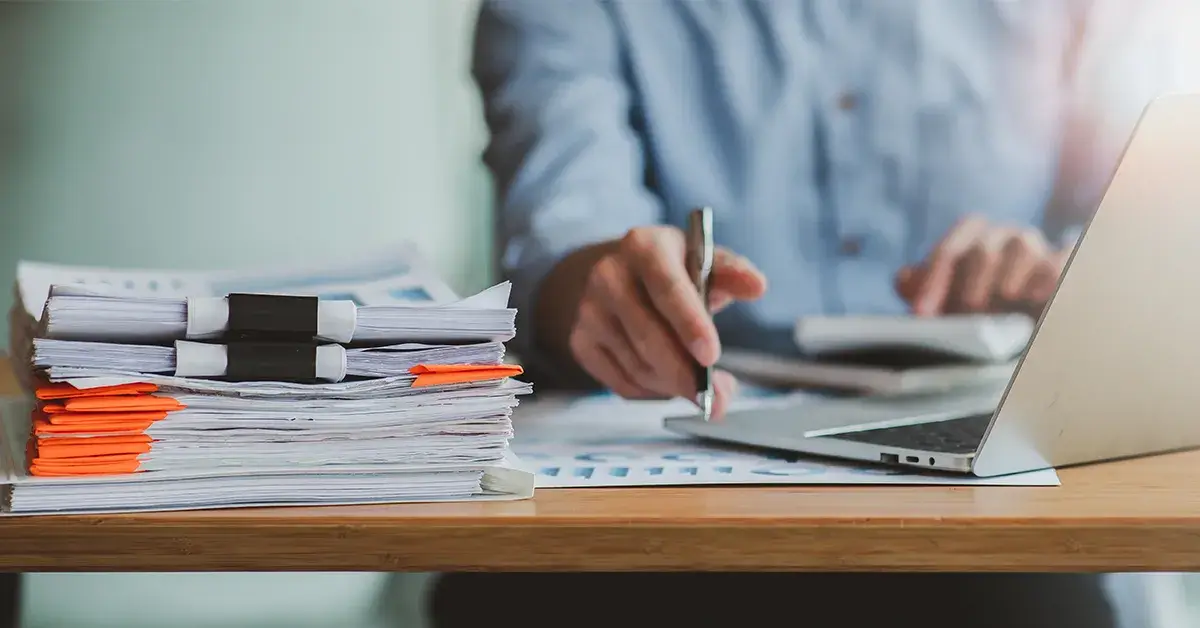 person sat at desk digitising documents