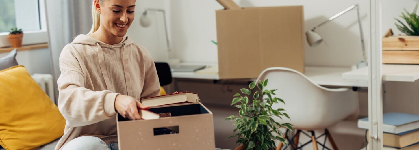 A student unpacking boxes at her student accomodation in Winchester University.