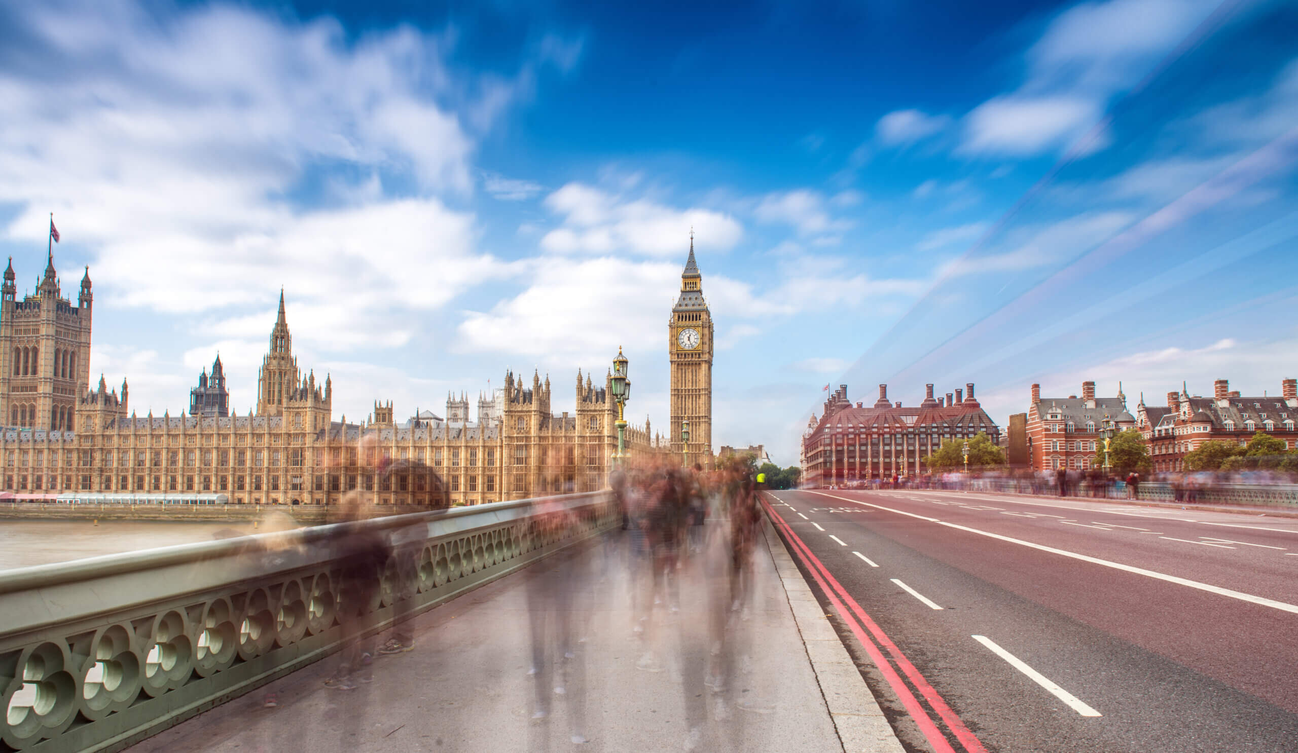 An image of a road leading into London with Big Ben in the distance.